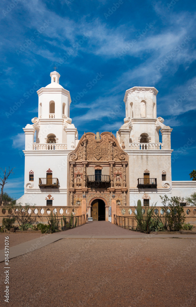 Frontal shot of Mission of San Xavier del Bac in Tucson with church tower and historic entrance