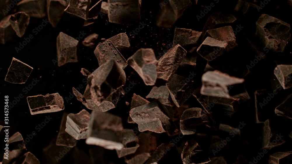 Super Slow Motion Shot of Raw Chocolate Chunks after Being Exploded Towards The Camera at 1000fps. Super Slow Motion Shot of Raw Chocolate Chunks after Being Exploded Towards The Camera at 1000fps.