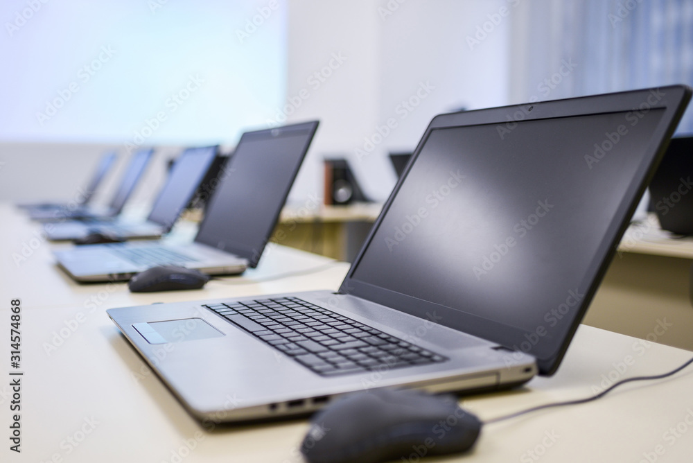 Laptops in a conference room Laptops in a conference room