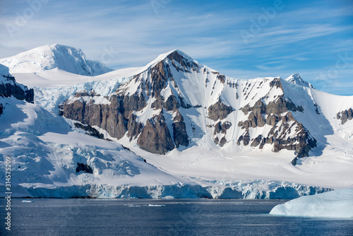 Antarctic landscape with iceberg at sea © Alexey Seafarer