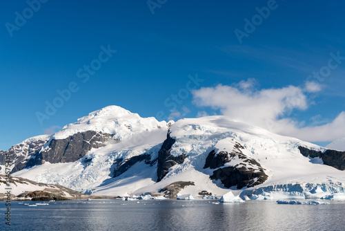 Antarctic landscape with iceberg at sea