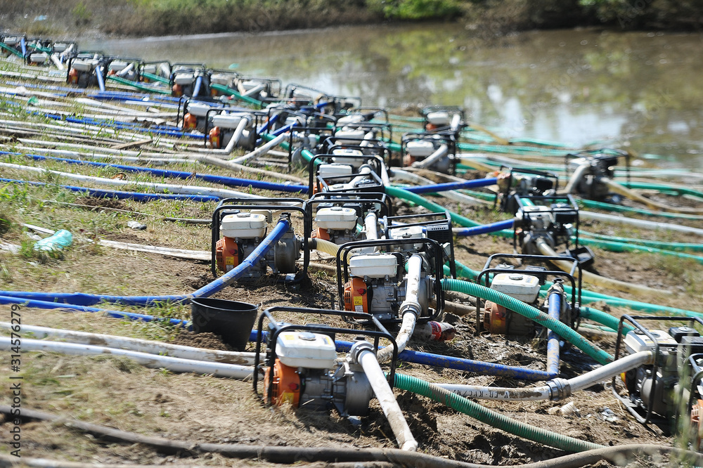 water pumps and large hoses for pumping water out of the flooded area water pumps and large hoses for pumping water out of the flooded area