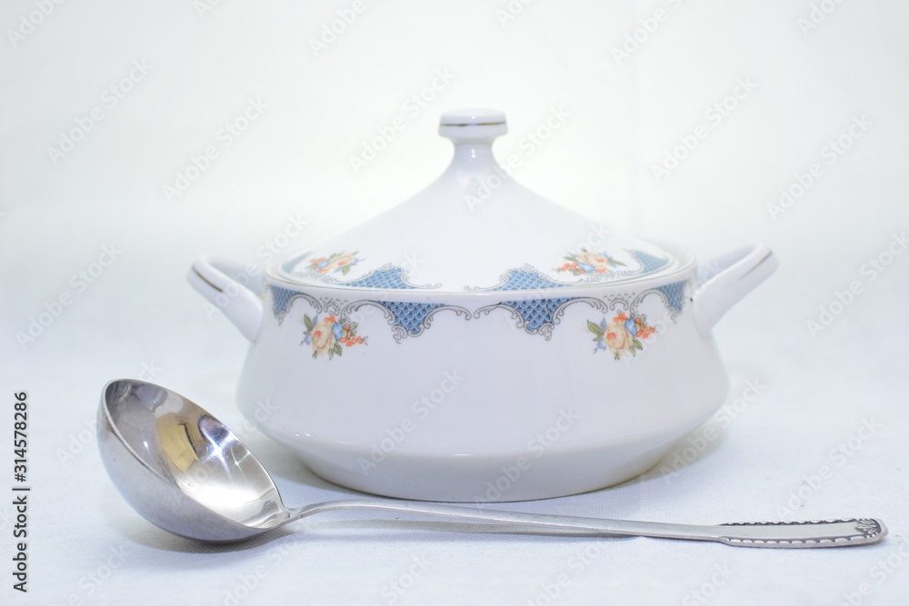 Mock up / design set of elegant and traditional teapot colorful white and blue coffee cup & Tea cup on cup's plate beside the hot tea pot , design/ drink-ware isolated on white background Mock up / design set of elegant and traditional teapot colorful white and blue coffee cup & Tea cup on cup's plate beside the hot tea pot , design/ drink-ware isolated on white background