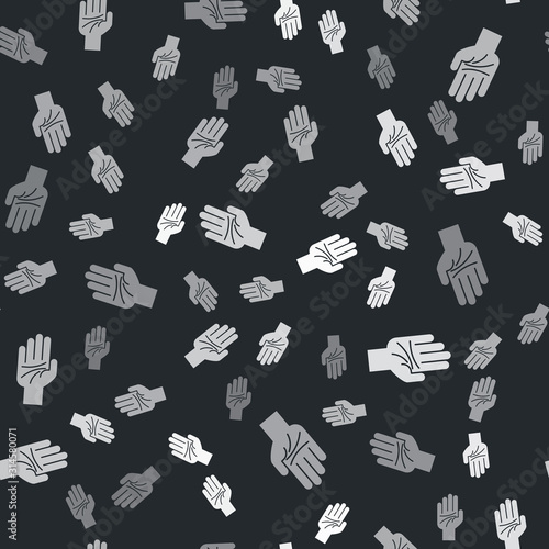 Grey Palmistry of the hand icon isolated seamless pattern on black background. Vector Illustration