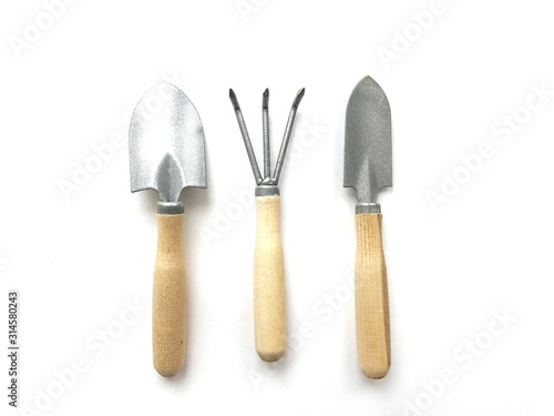 Gardening tools arranged isolated on white background.