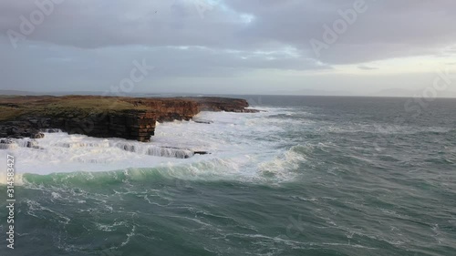 Huge waves breaking at Muckross Head - A small peninsula west of Killybegs, County Donegal, Ireland. The cliff rocks are famous for climbing photo