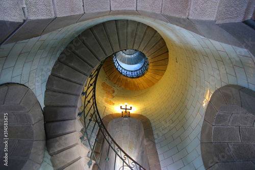 Looking up the spiral staircase inside the Eckmuhl lighthouse in Brittany, France