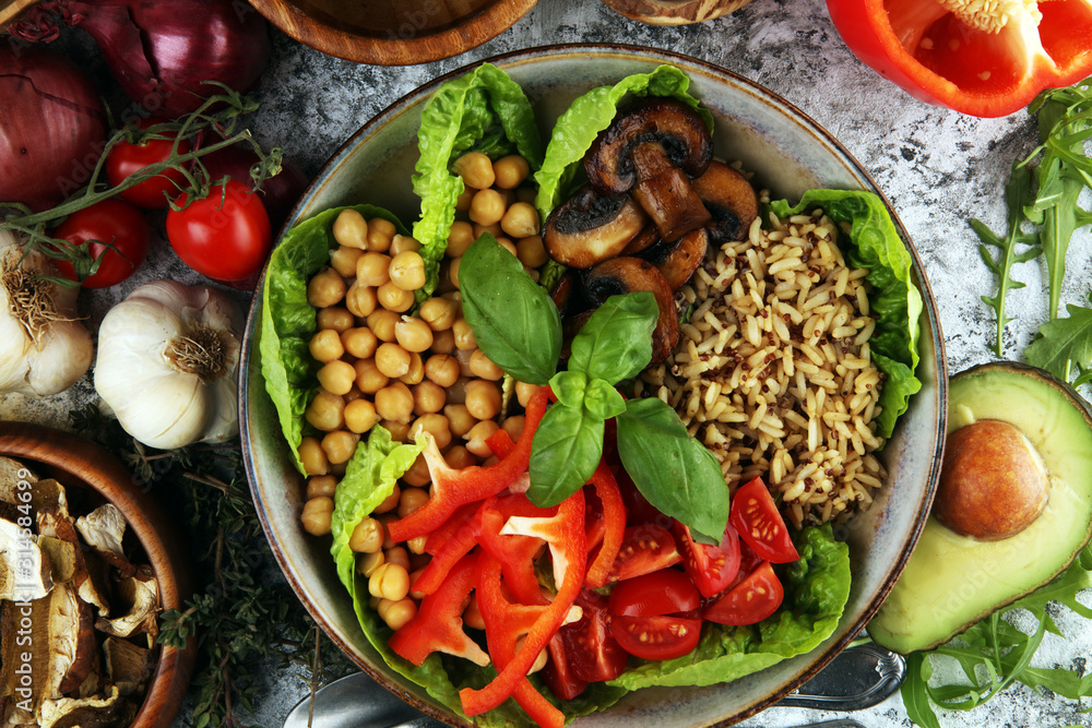 Quinoa and spicy chickpea vegetable vegetarian buddha bowl. Healthy food concept with tomato