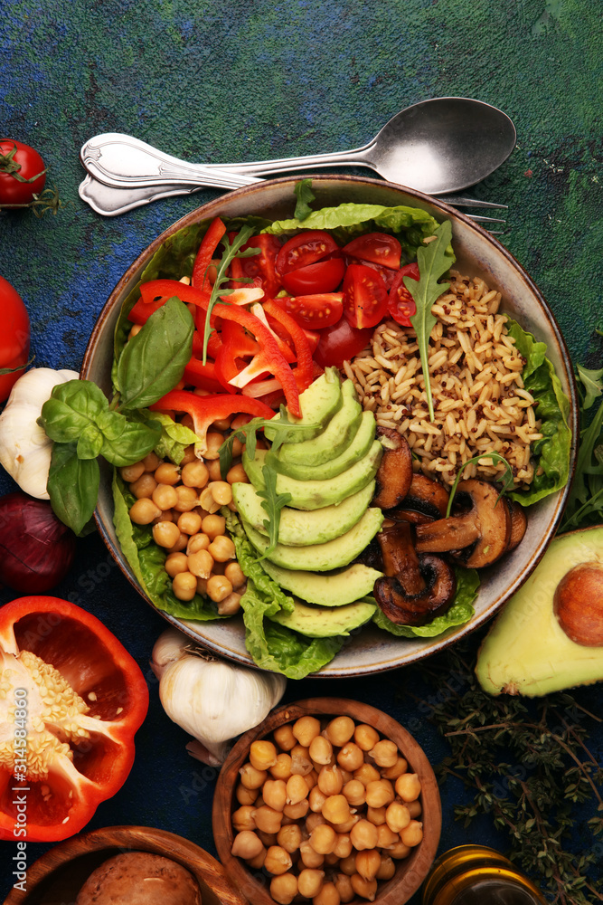 Quinoa and spicy chickpea vegetable vegetarian buddha bowl. Healthy food concept with tomato Quinoa and spicy chickpea vegetable vegetarian buddha bowl. Healthy food concept with tomato