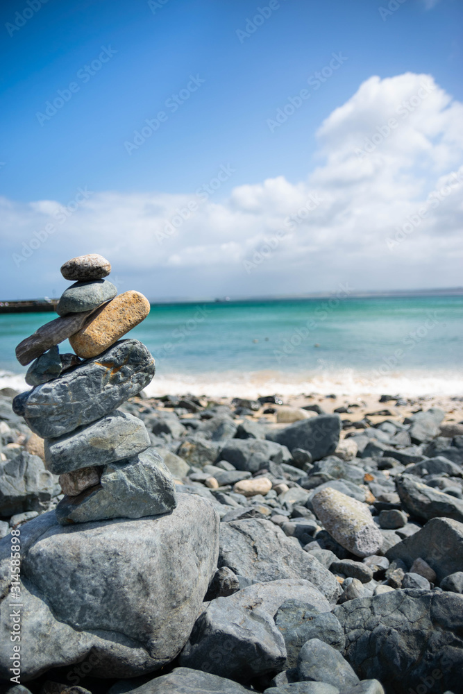 Rock balancing infront of sea Rock balancing infront of sea