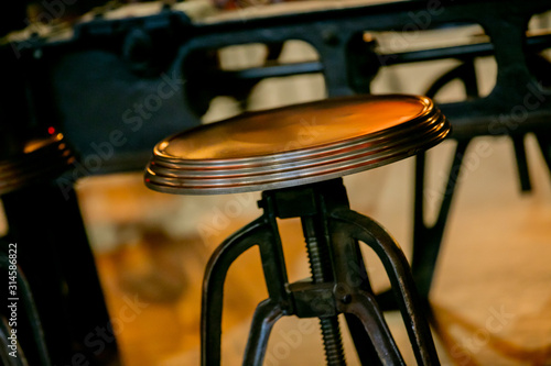 Inspired by Steampunk design, steel and copper stools in a restaurant