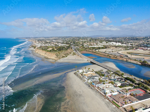 Aerial view of Del Mar North Beach, California coastal cliffs and House with blue Pacific ocean. San Diego County, California, USA