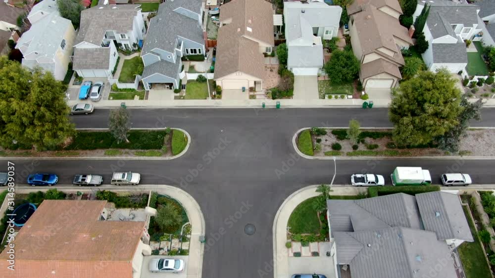 Aerial view of urban sprawl. Suburban packed homes neighborhood with road. Vast subdivision in Irvine, California, USA Aerial view of urban sprawl. Suburban packed homes neighborhood with road. Vast subdivision in Irvine, California, USA
