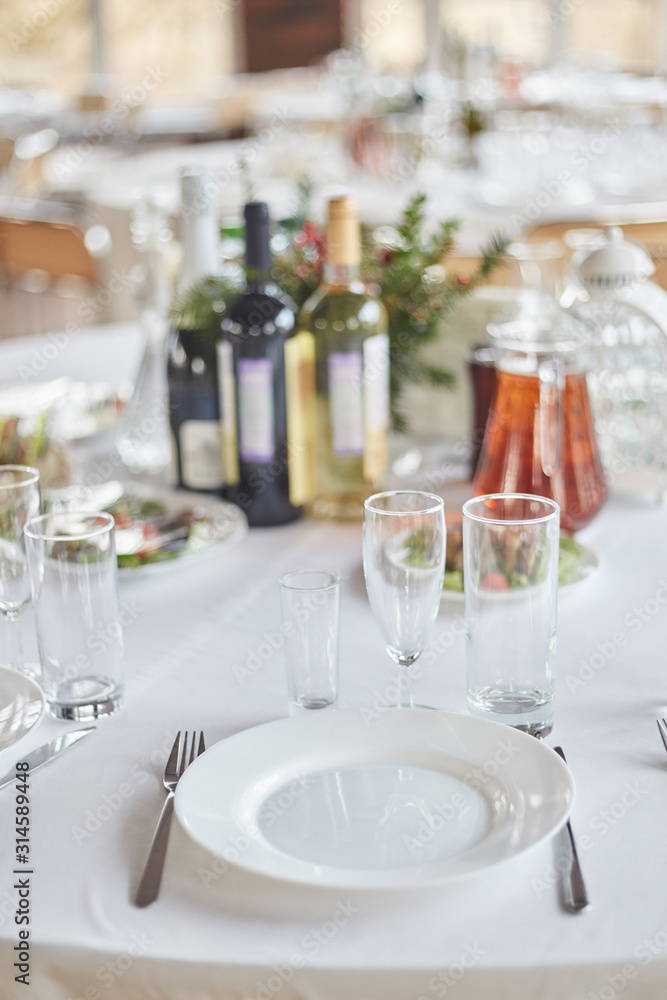 Table set for an event party or wedding reception. Table set for an event party or wedding reception.