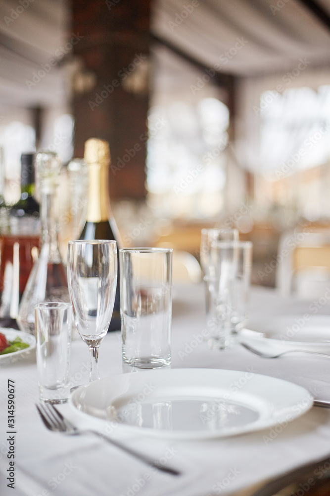 Table set for an event party or wedding reception. Table set for an event party or wedding reception.