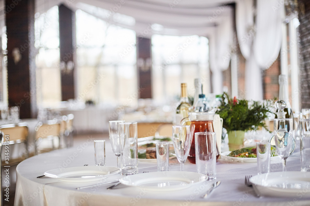 Table set for an event party or wedding reception. Table set for an event party or wedding reception.