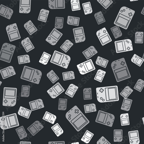 Grey Portable video game console icon isolated seamless pattern on black background. Gamepad sign. Gaming concept. Vector Illustration