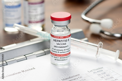 Hepatitis B Vaccine Vial On Desk photo