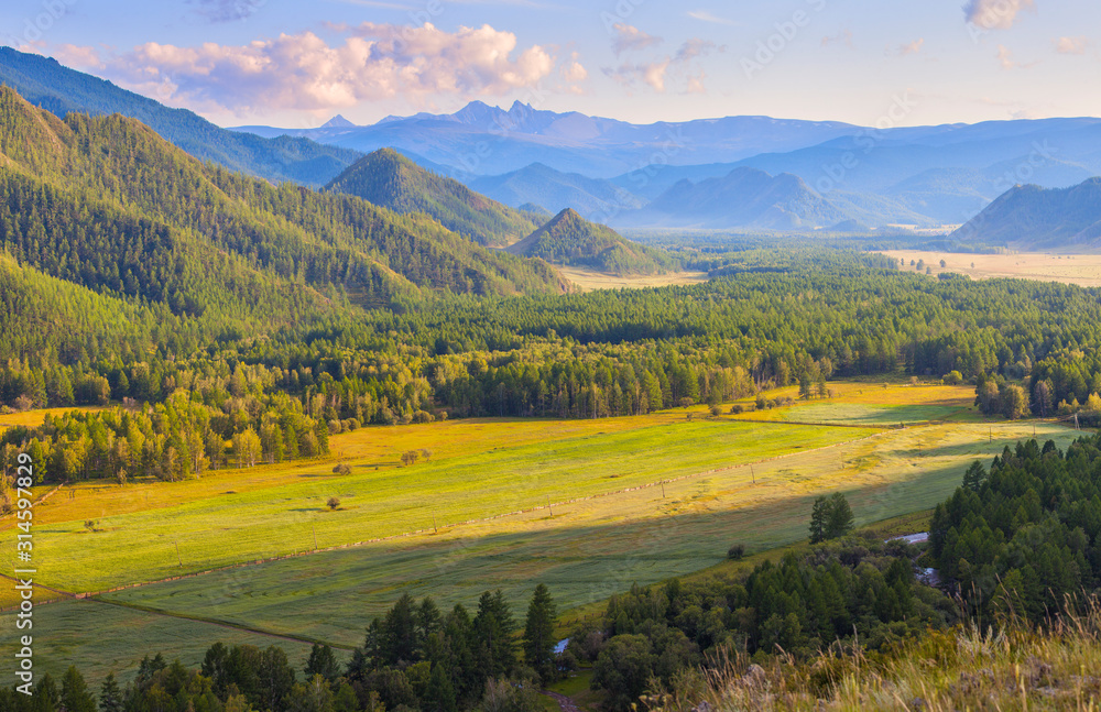 Evening light in a picturesque valley, Altai mountains. Travel and vacation in the mountains.