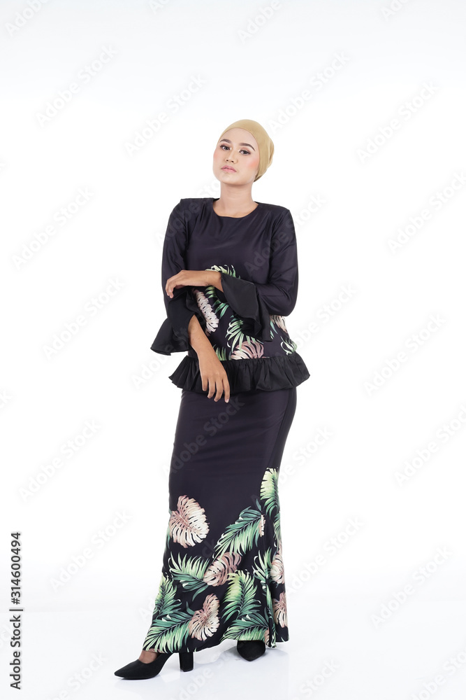 Beautiful female model in various poses wearing modern kurung, a modern urban lifestyle apparel for Muslim women isolated on white background. Beauty and hijab fashion concept. Beautiful female model in various poses wearing modern kurung, a modern urban lifestyle apparel for Muslim women isolated on white background. Beauty and hijab fashion concept.