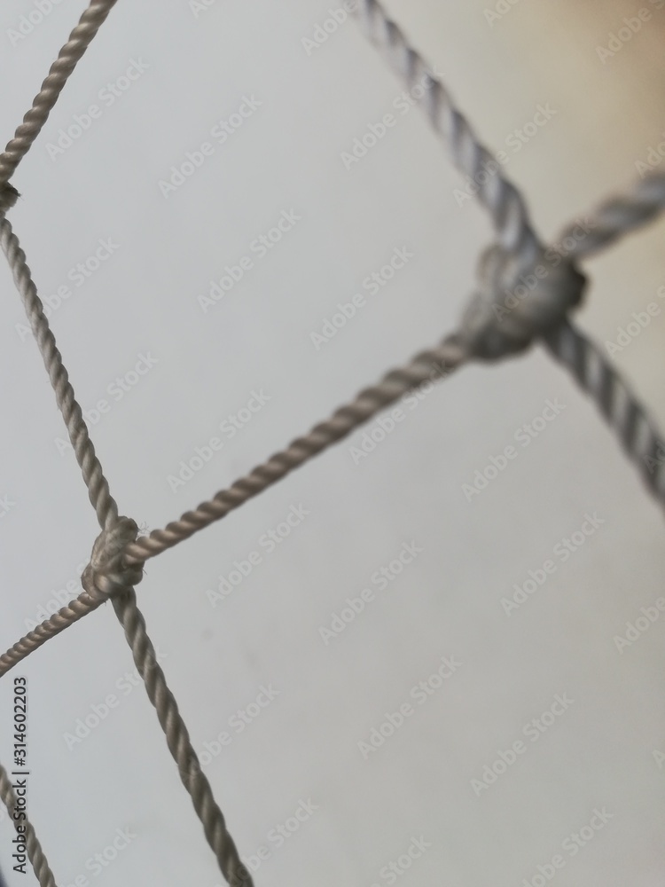 fragment of cells of a rope grid with knots 