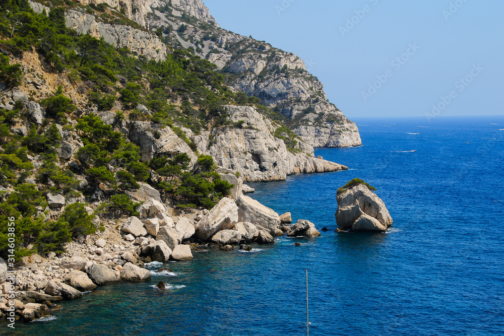 Turquoise waters in the Calanque de Sugiton - Mountains on the coast of Provence in the Mediterranean Sea near Marseille, France