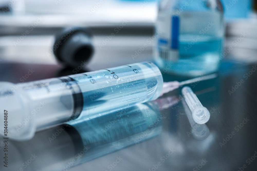 syringe and vials of medicine on white background syringe and vials of medicine on white background