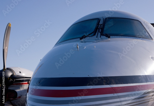 A personal jet against a blue sky