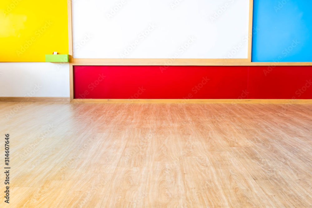 Beautiful kindergarten classroom that has colorful white board and table in the class. Beautiful kindergarten classroom that has colorful white board and table in the class.