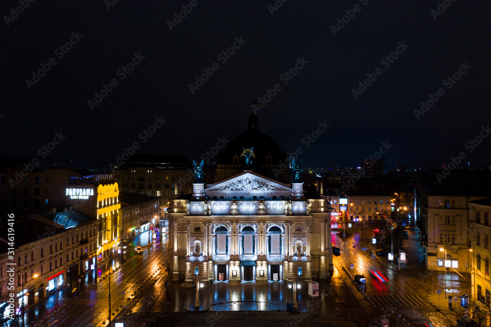 Aerial view on Lviv Opera at night from drone