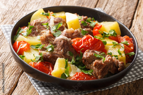 Armenian and Georgian Khashlama stew of meat with vegetables close-up in a bowl. horizontal