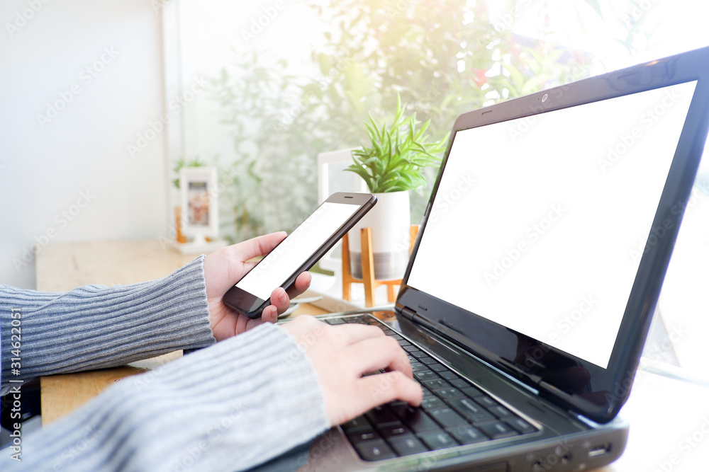 Cropped shot view of business woman’s hands typing the labtop with blank copy space screen for your information content or text message.