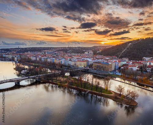 Prague, Czech Republic - Aerial panoramic drone view of Strelecky Island with a beautiful winter sunset and colorful sky