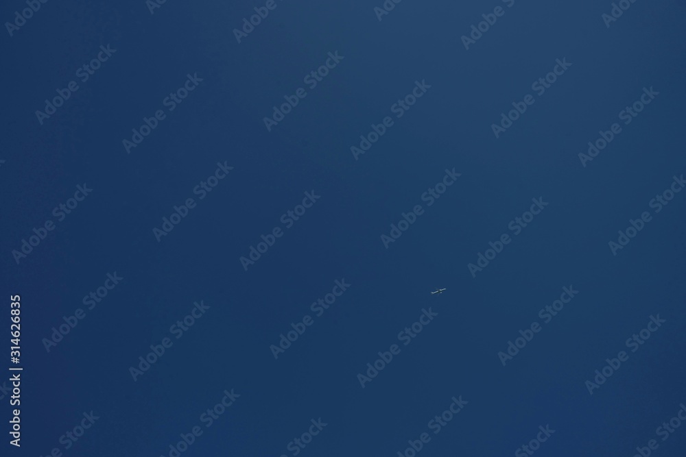 Airplane flying in the blue sky without cloud as the scene Airplane flying in the blue sky without cloud as the scene