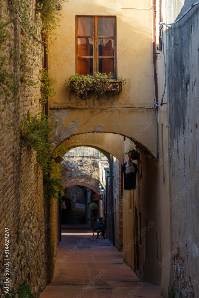 Street in the historic centre of San Gimignano town, Italy