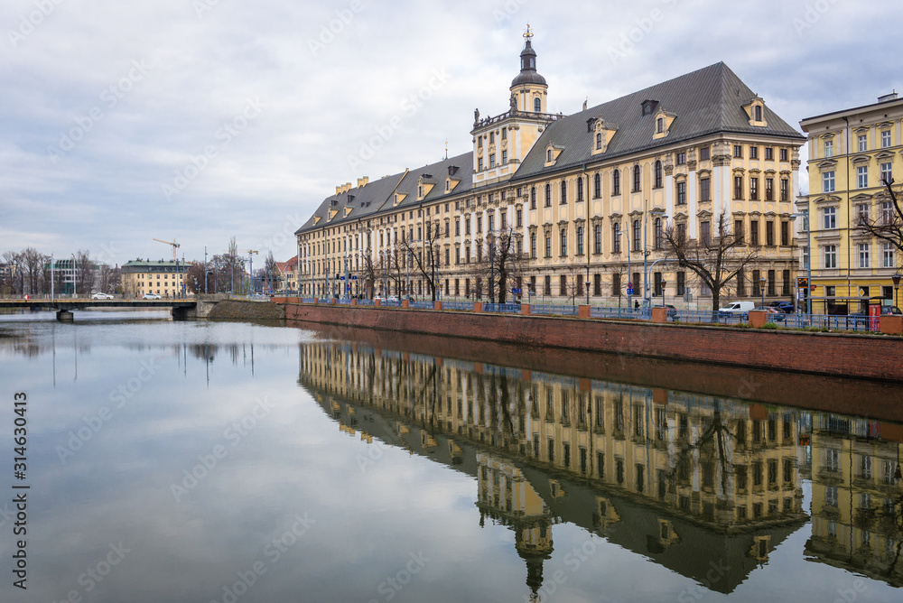Obraz premium University of Wroclaw building on the bank of Oder river in historic part of Wroclaw, capital city of Lower Silesian Province, Poland