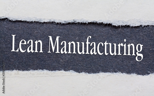 Lean Manufacturing words under torn black paper.