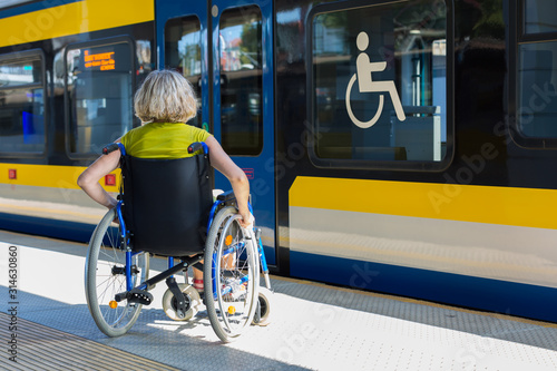 woman sitting on wheelchair on a platform