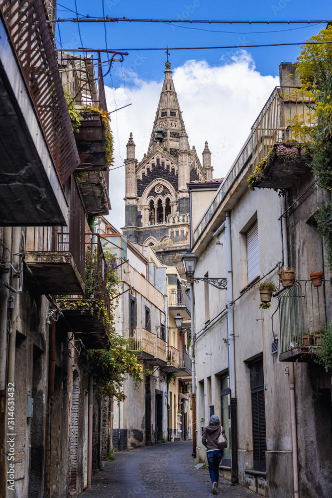 View from narrow street on a bell tower of Basilica of Santa Maria Assunta located in historic part of Randazzo city on Sicily Island in Italy View from narrow street on a bell tower of Basilica of Santa Maria Assunta located in historic part of Randazzo city on Sicily Island in Italy
