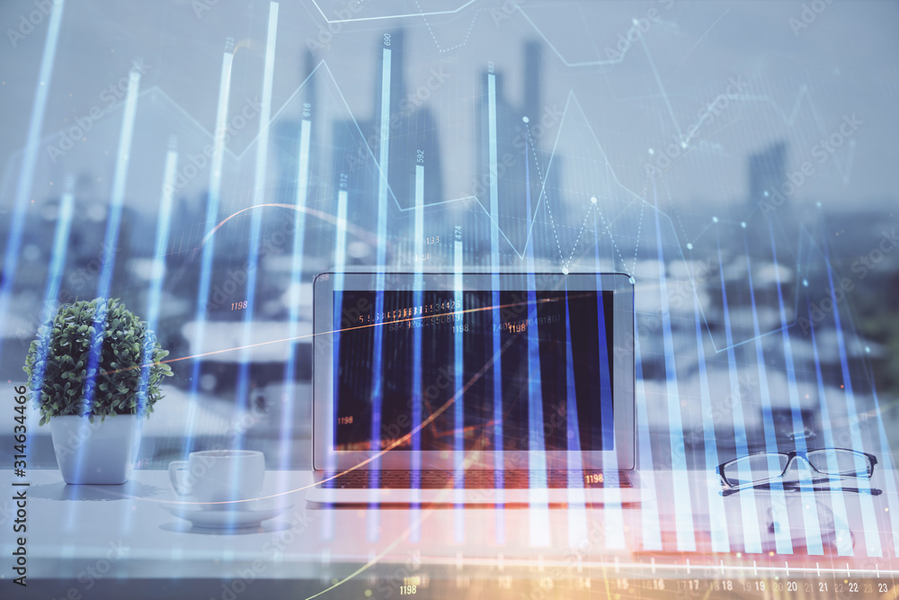 Forex graph hologram on table with computer background. Multi exposure. Concept of financial markets. Forex graph hologram on table with computer background. Multi exposure. Concept of financial markets.