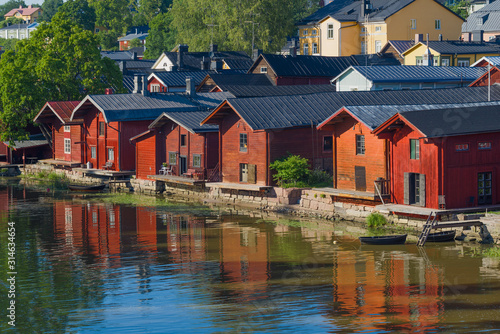 Old red barns on the Porvoonyoki River on a sunny July day. Old Porvoo, Finland