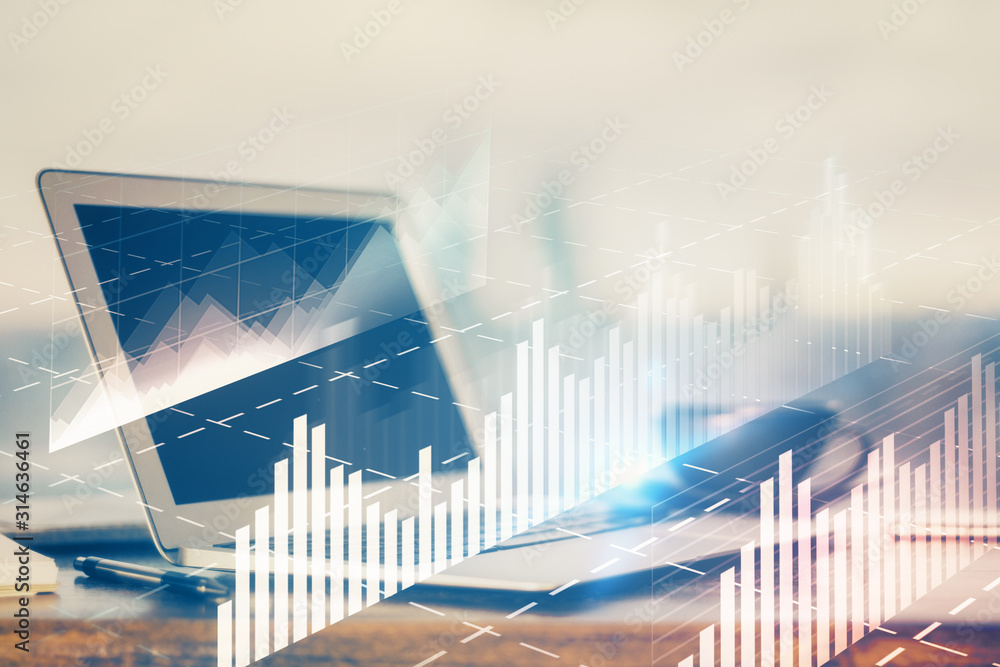 Forex Chart hologram on table with computer background. Multi exposure. Concept of financial markets. Forex Chart hologram on table with computer background. Multi exposure. Concept of financial markets.
