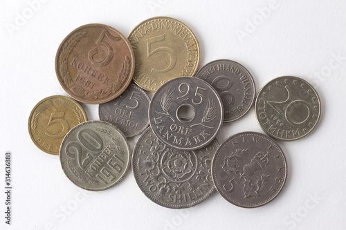 stack of old coins on white background.