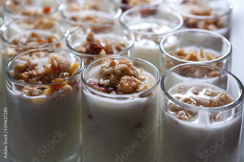 Yogurt in cups sprinkled with nuts