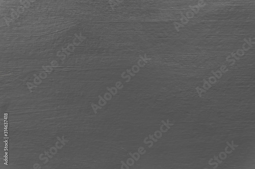 Painted light grey wall with brush stroke marks texture throughout destined for use as a background image.