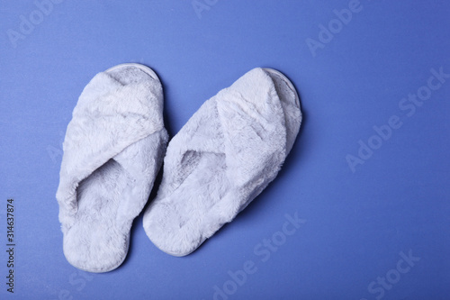 slippers on a colored background top view.