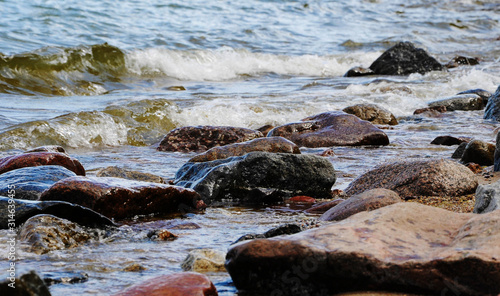 sea shore, stones on the shore, close-up, blurred background