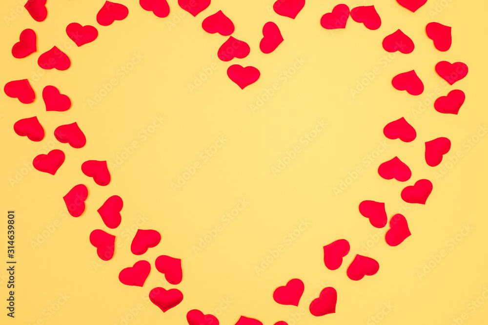 Heart shaped frame on yellow background. Copy space. Valentine's day concept.