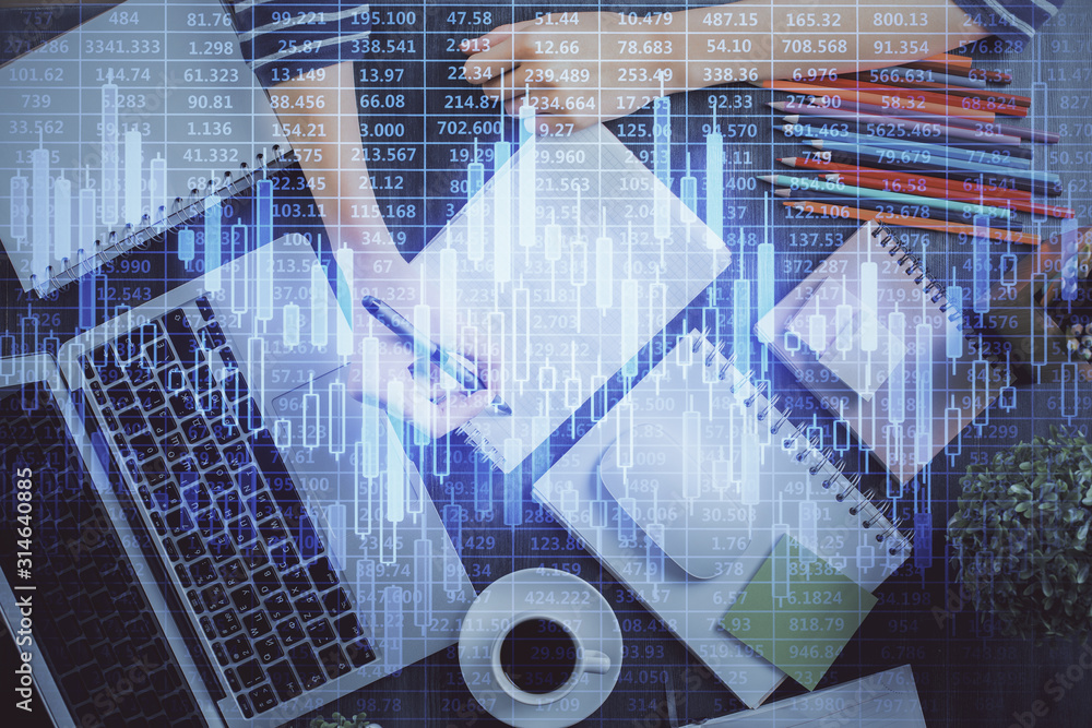 Financial chart drawn over hands taking notes background. Concept of research. Double exposure Financial chart drawn over hands taking notes background. Concept of research. Double exposure