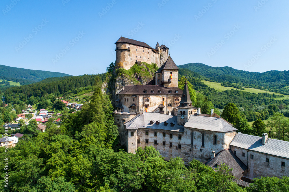 Orava castle - Oravsky Hrad in Oravsky Podzamok in Slovakia. Medieval stronghold on extremely high and steep cliff. Aerial view